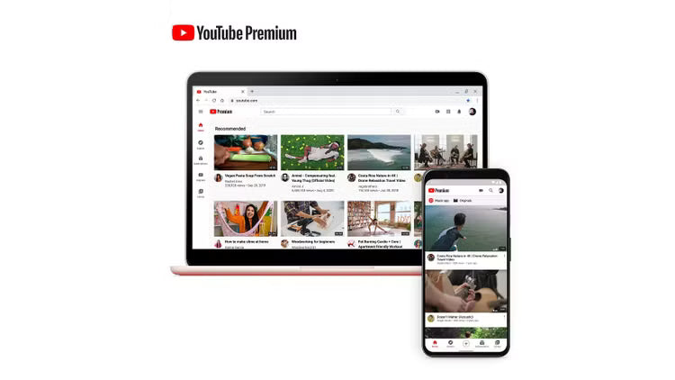 Лаптоп и смартфон, показващи YouTube Premium на бял фон